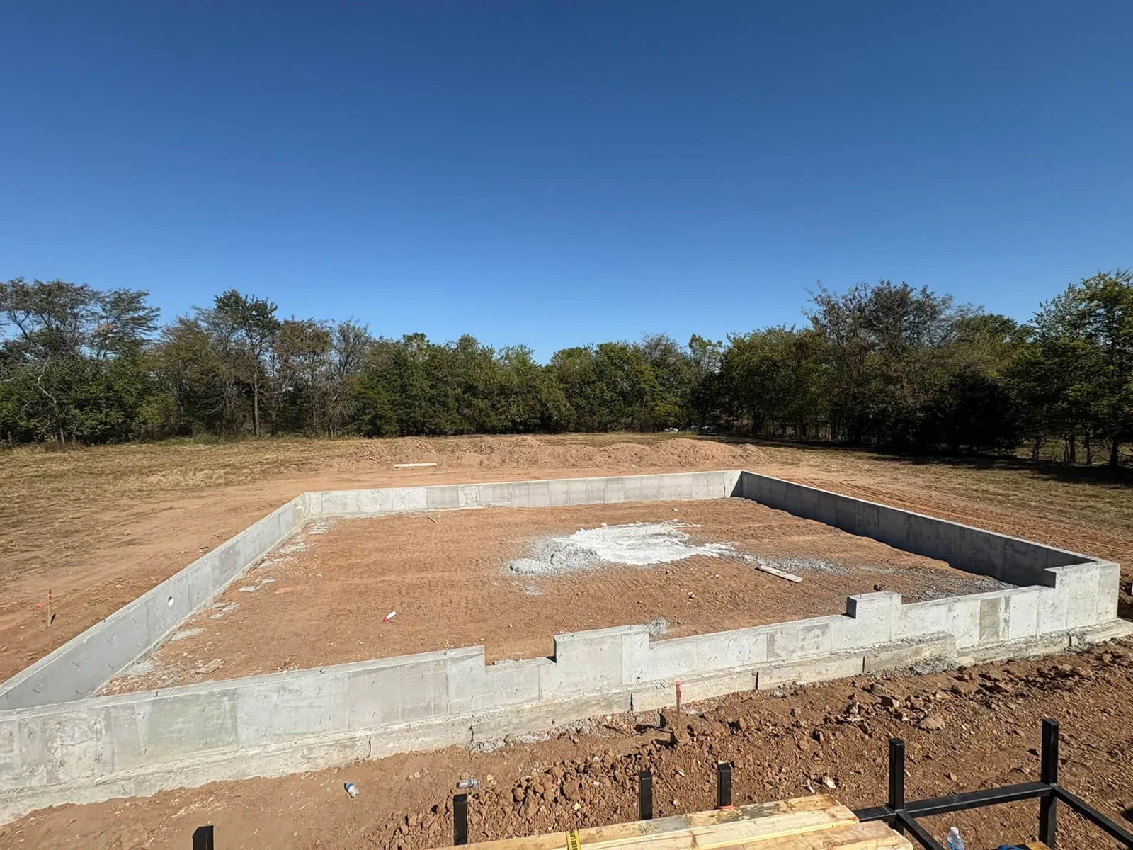 Concrete slab foundation and perimeter footing layout at a building site